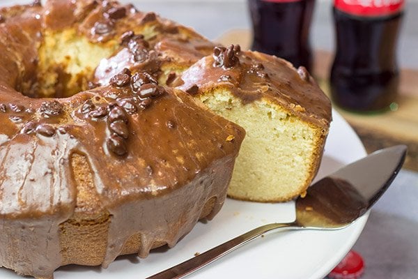 Topped with a chocolate glaze, this Coca Cola Pound Cake is a unique dessert idea! Grab a slice today!
