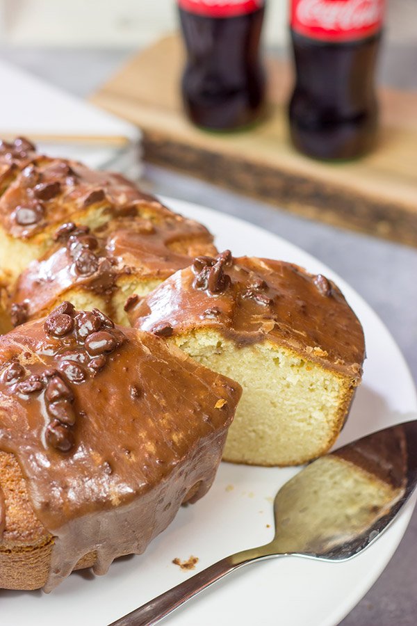 Topped with a chocolate glaze, this Coca Cola Pound Cake is a unique dessert idea! Grab a slice today!