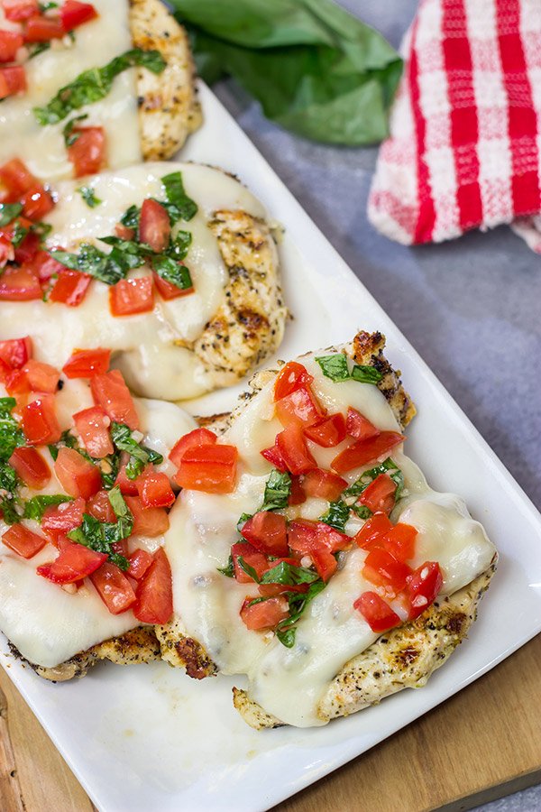 This Grilled Bruschetta Chicken is an easy recipe that's packed with flavor.  It's perfect for dinner in the backyard on a warm summer night!