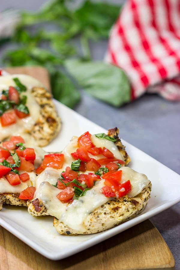 This Grilled Bruschetta Chicken is an easy recipe that's packed with flavor.  It's perfect for dinner in the backyard on a warm summer night!