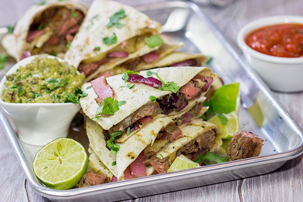Fire up the grill! This Grilled Skirt Steak Quesadillas recipe is a tasty way to enjoy summer grilling season!