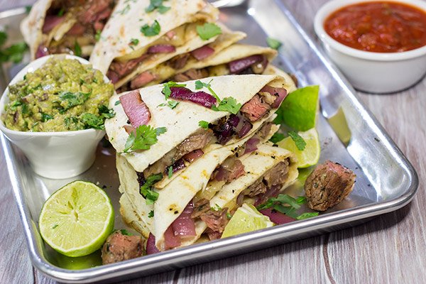 Fire up the grill! This Grilled Skirt Steak Quesadillas recipe is a tasty way to enjoy summer grilling season!