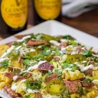 Get into the St. Patrick's Day spirit with a batch of these Irish Nachos - waffle fries loaded with cheese, salsa verde and chopped corned beef!