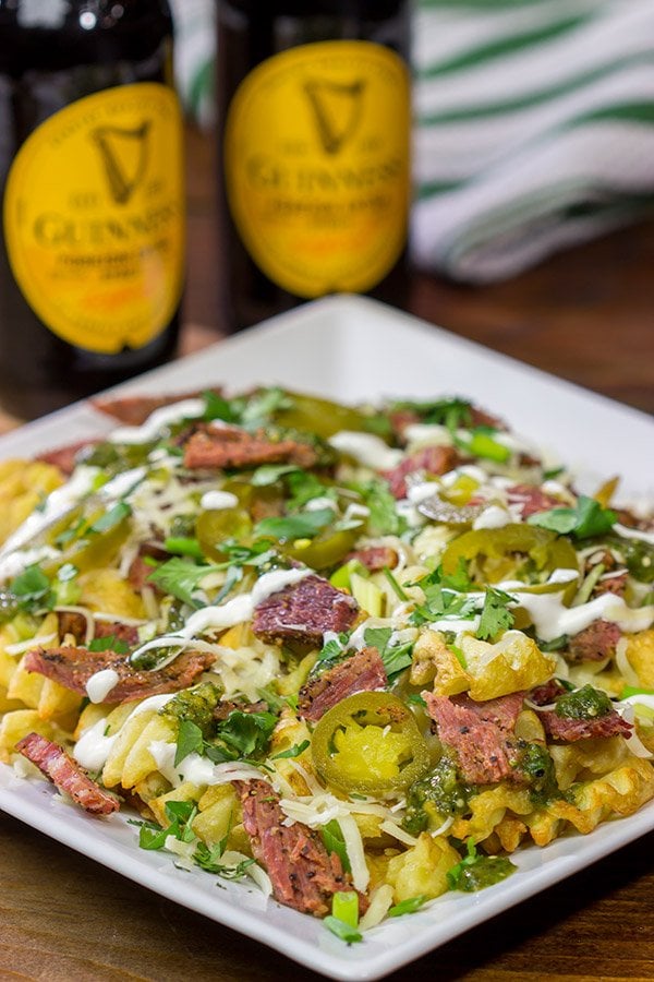 Get into the St. Patrick's Day spirit with a batch of these Irish Nachos - waffle fries loaded with cheese, salsa verde and chopped corned beef!