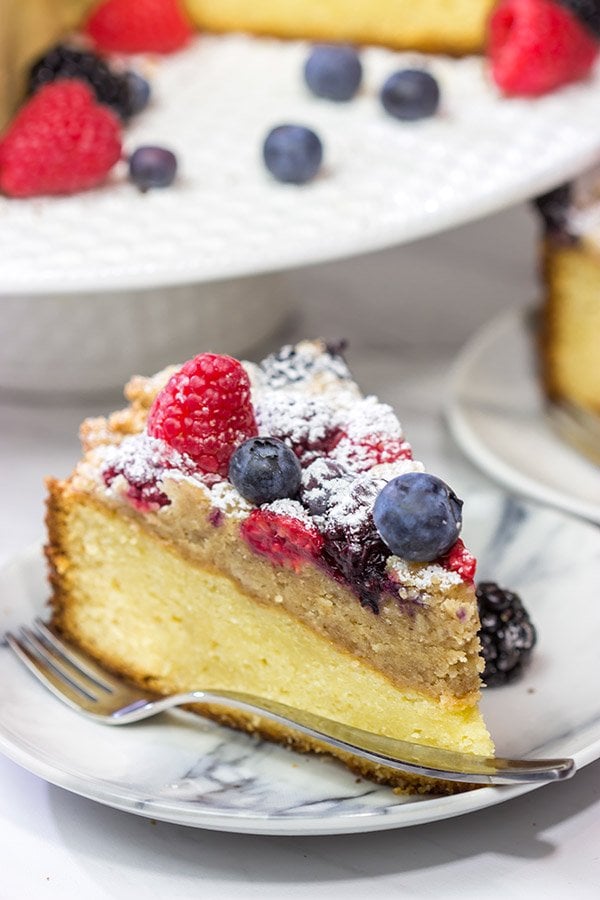 Topped with fresh berries and dusted with powdered sugar, this Mixed Berry Topped Coffee Cake is a great way to celebrate summer berry season!
