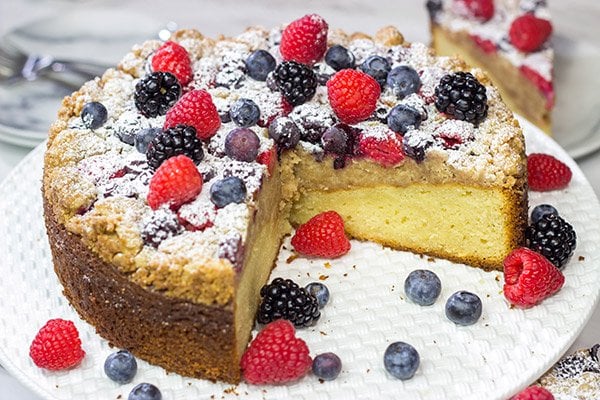 Topped with fresh berries and dusted with powdered sugar, this Mixed Berry Topped Coffee Cake is a great way to celebrate summer berry season!