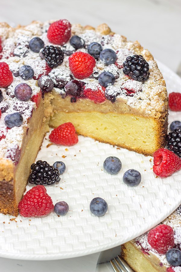 Topped with fresh berries and dusted with powdered sugar, this Mixed Berry Topped Coffee Cake is a great way to celebrate summer berry season!