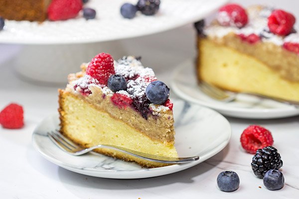 Topped with fresh berries and dusted with powdered sugar, this Mixed Berry Topped Coffee Cake is a great way to celebrate summer berry season!