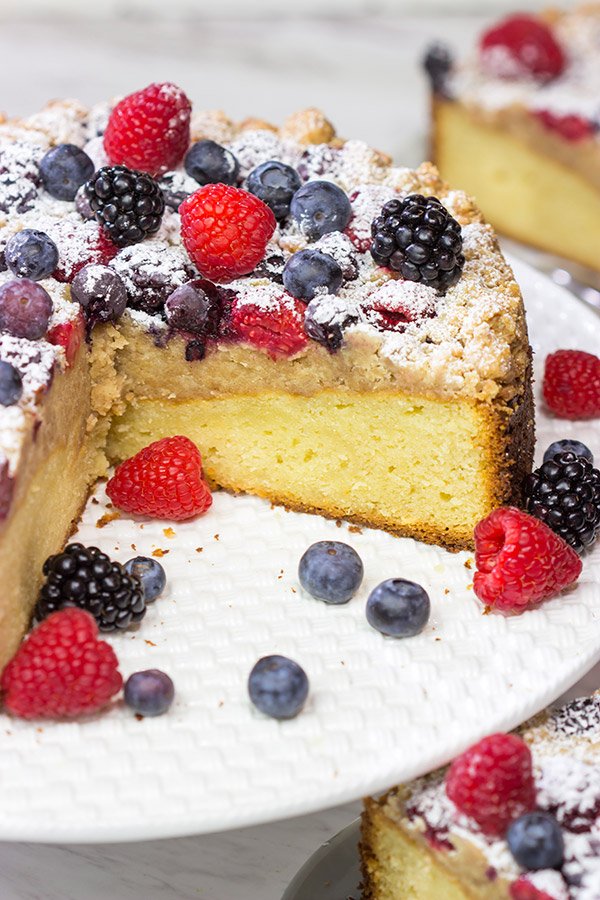Topped with fresh berries and dusted with powdered sugar, this Mixed Berry Topped Coffee Cake is a great way to celebrate summer berry season!