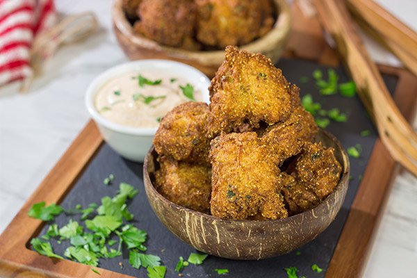 Take your fried food game to a whole new level!  These Crab Cake Hushpuppies combine two favorites into one.