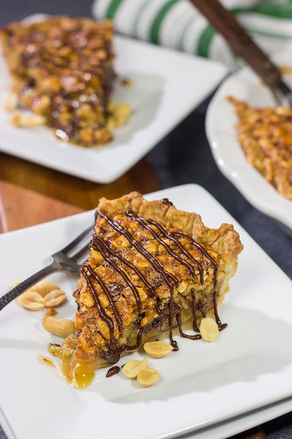 Love salty + sweet desserts?  Then grab a handful of peanuts and chocolate chips and bake up this Chocolate Peanut Pie today!