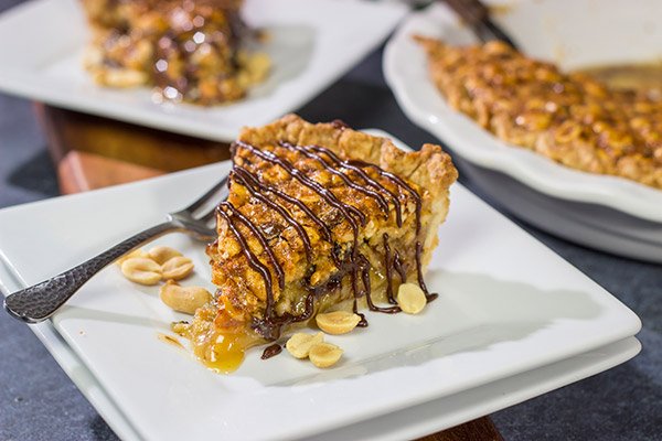 Love salty + sweet desserts?  Then grab a handful of peanuts and chocolate chips and bake up this Chocolate Peanut Pie today!