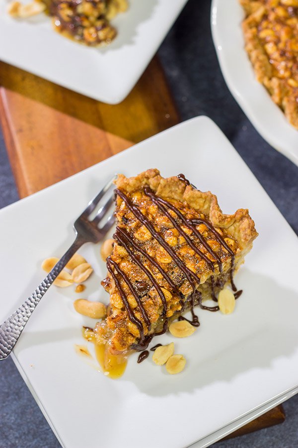 Love salty + sweet desserts?  Then grab a handful of peanuts and chocolate chips and bake up this Chocolate Peanut Pie today!