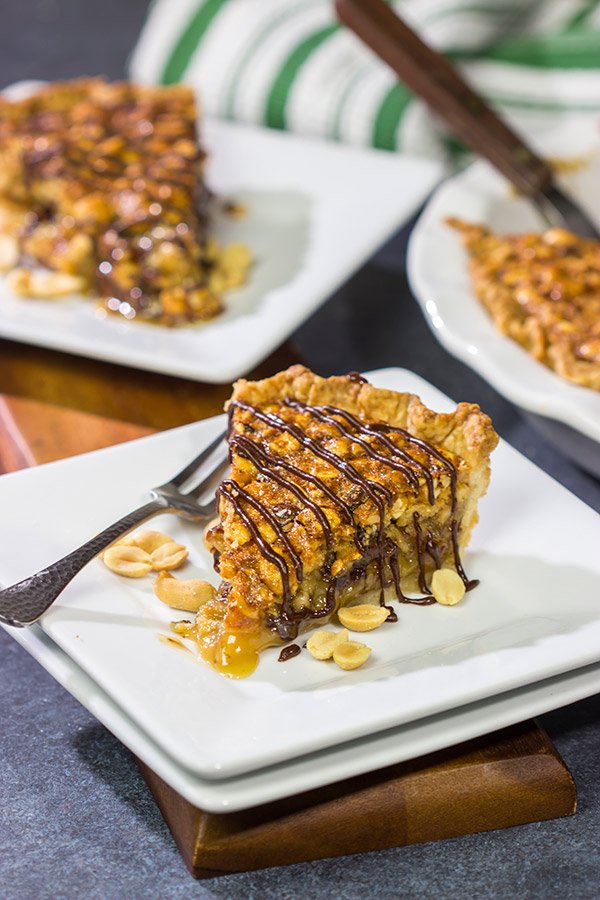 Love salty + sweet desserts?  Then grab a handful of peanuts and chocolate chips and bake up this Chocolate Peanut Pie today!