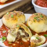Put a twist on classic meatballs - by stuffing 'em with mozzarella!  These Mozzarella Stuffed Meatball Bites are a fun combination of meatballs and pizza!