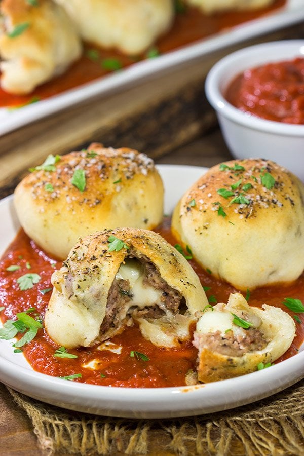 Put a twist on classic meatballs - by stuffing 'em with mozzarella!  These Mozzarella Stuffed Meatball Bites are a fun combination of meatballs and pizza!