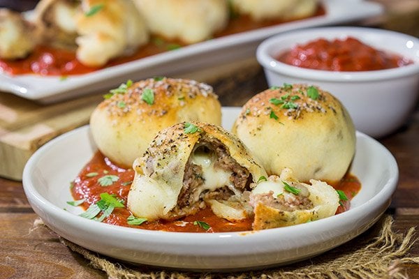 Put a twist on classic meatballs - by stuffing 'em with mozzarella! These Mozzarella Stuffed Meatball Bites are a fun combination of meatballs and pizza!