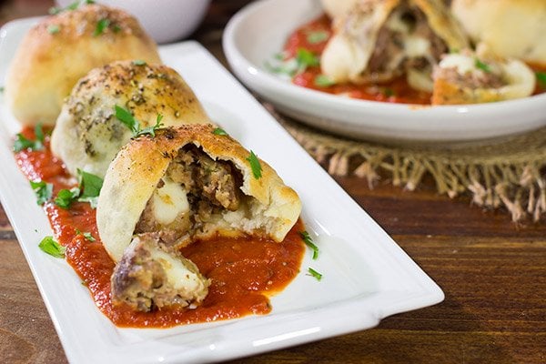 Put a twist on classic meatballs - by stuffing 'em with mozzarella! These Mozzarella Stuffed Meatball Bites are a fun combination of meatballs and pizza!
