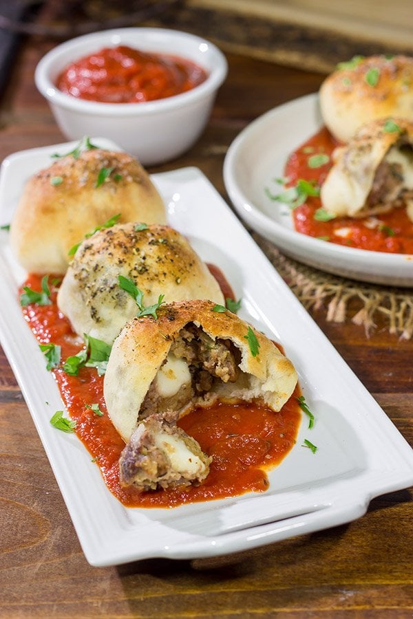Put a twist on classic meatballs - by stuffing 'em with mozzarella! These Mozzarella Stuffed Meatball Bites are a fun combination of meatballs and pizza!