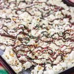 Looking for a fun holiday snack?  This Peppermint Bark Popcorn is a festive and easy recipe to make for the holidays!