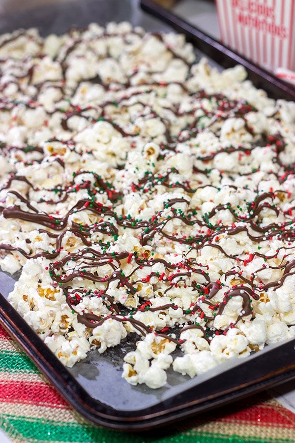 Looking for a fun holiday snack?  This Peppermint Bark Popcorn is a festive and easy recipe to make for the holidays!