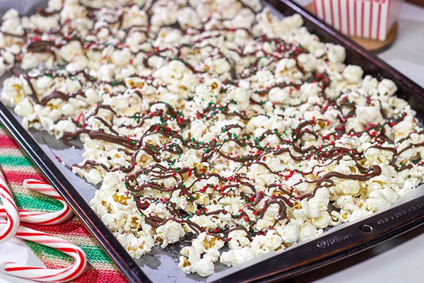 Looking for a fun holiday snack?  This Peppermint Bark Popcorn is a festive and easy recipe to make for the holidays!