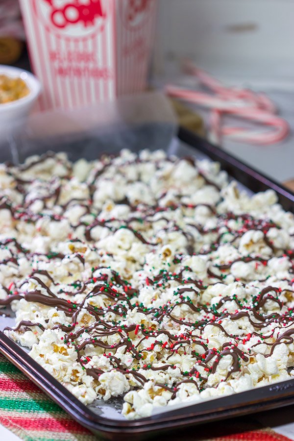 Looking for a fun holiday snack?  This Peppermint Bark Popcorn is a festive and easy recipe to make for the holidays!