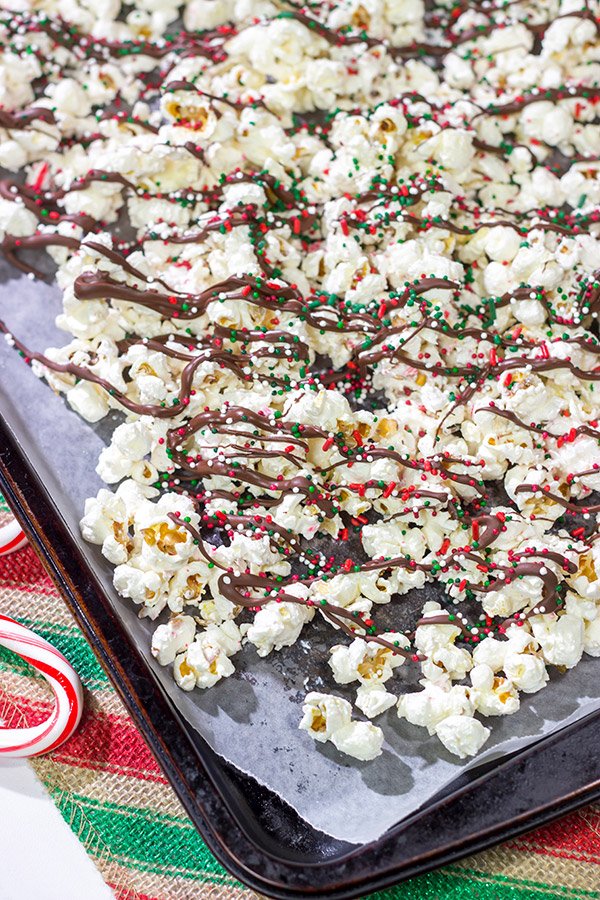 Looking for a fun holiday snack?  This Peppermint Bark Popcorn is a festive and easy recipe to make for the holidays!