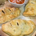 Looking for some tasty comfort food?  Grab some pizza dough and make this Sausage and Peppers Calzone for dinner tonight!