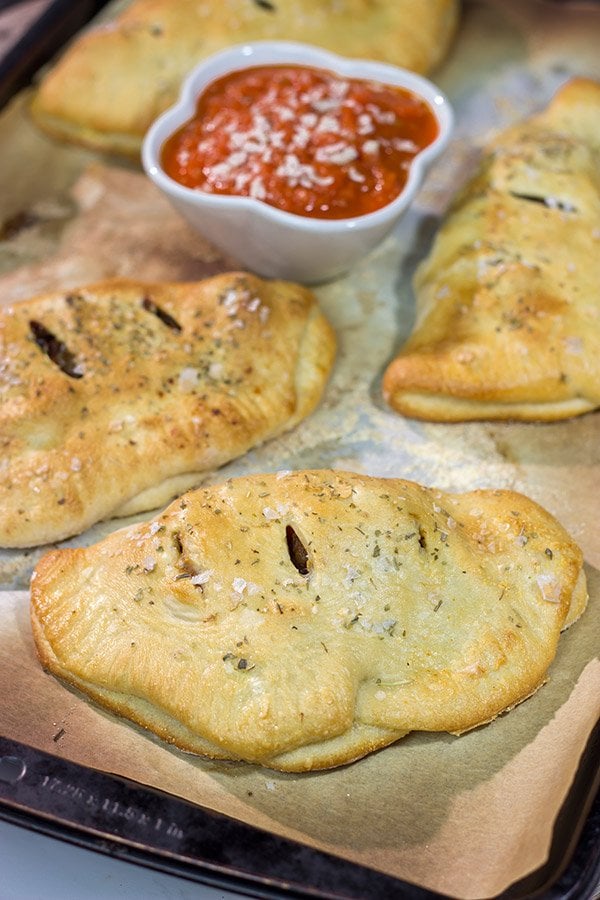 Looking for some tasty comfort food?  Grab some pizza dough and make this Sausage and Peppers Calzone for dinner tonight!