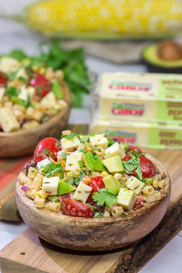 Packed with corn, beans, green chile and peppers, this Southwestern Pasta Salad packs quite a flavorful punch.  It's a great summer side dish!