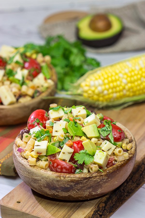 Packed with corn, beans, green chile and peppers, this Southwestern Pasta Salad packs quite a flavorful punch. It's a great summer side dish!