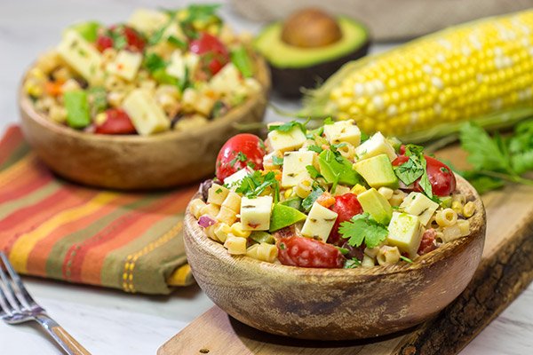 Packed with corn, beans, green chile and peppers, this Southwestern Pasta Salad packs quite a flavorful punch. It's a great summer side dish!