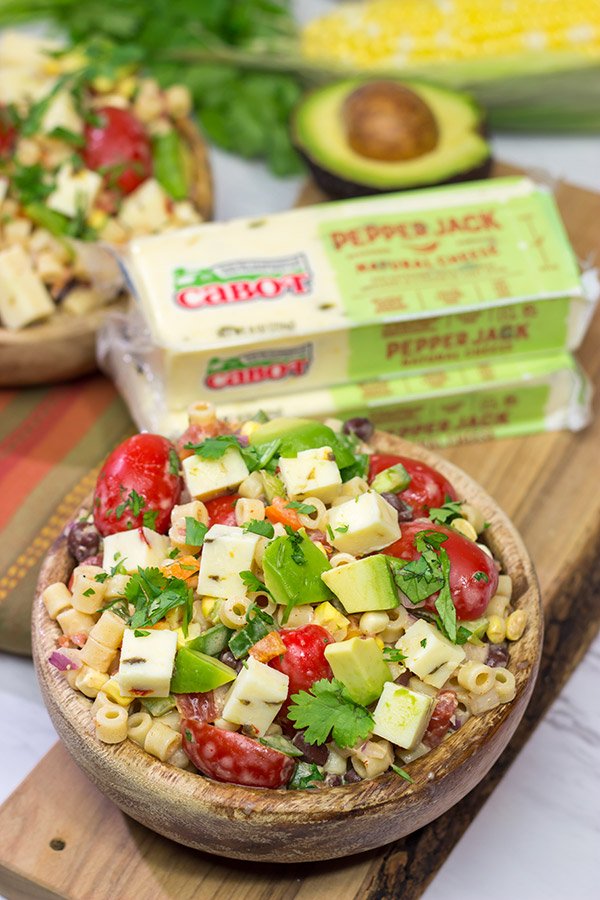 Packed with corn, beans, green chile and peppers, this Southwestern Pasta Salad packs quite a flavorful punch. It's a great summer side dish!