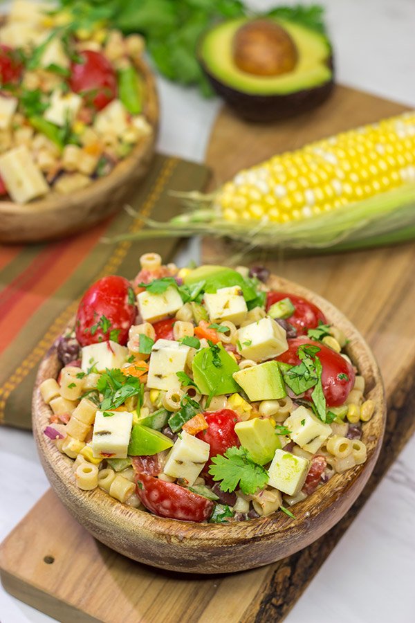 Packed with corn, beans, green chile and peppers, this Southwestern Pasta Salad packs quite a flavorful punch. It's a great summer side dish!