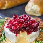 Looking for a unique holiday appetizer?  This Brie with Cranberry Sauce is an easy but impressive appetizer to make - it's perfect for holiday get-togethers!