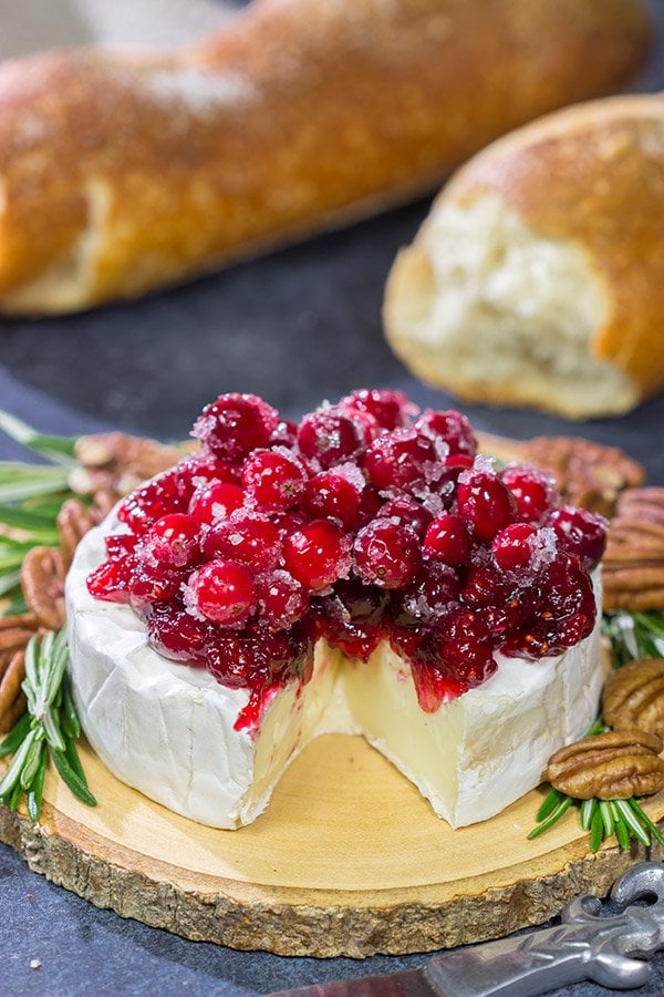 Looking for a unique holiday appetizer? This Brie with Cranberry Sauce is an easy but impressive appetizer to make - it's perfect for holiday get-togethers!