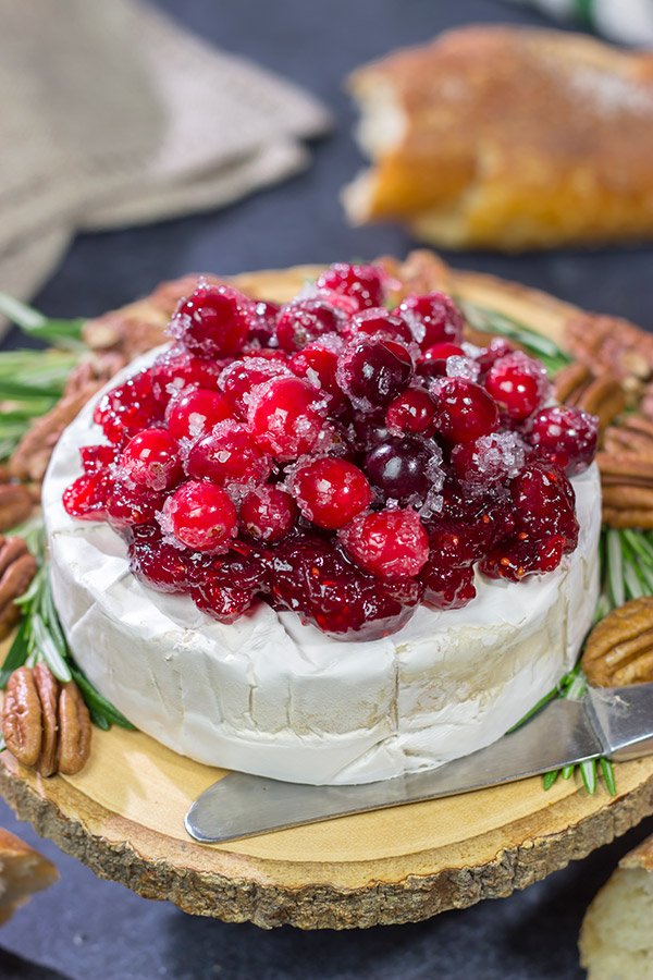 Looking for a unique holiday appetizer? This Brie with Cranberry Sauce is an easy but impressive appetizer to make - it's perfect for holiday get-togethers!