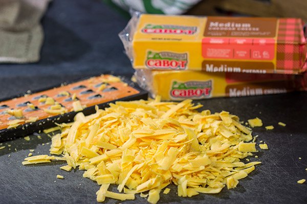 Want to break out of the 'dinner rut'? Then put these Cheesy Baked Burritos on the menu! Topped with an easy, homemade cheese sauce, these burritos are the perfect comfort food for chilly days!