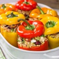Looking for a tasty way to shake the winter blues? Put these Couscous Stuffed Peppers on the dinner menu! Packed with Mediterranean flavor, these peppers were a huge hit in our house!