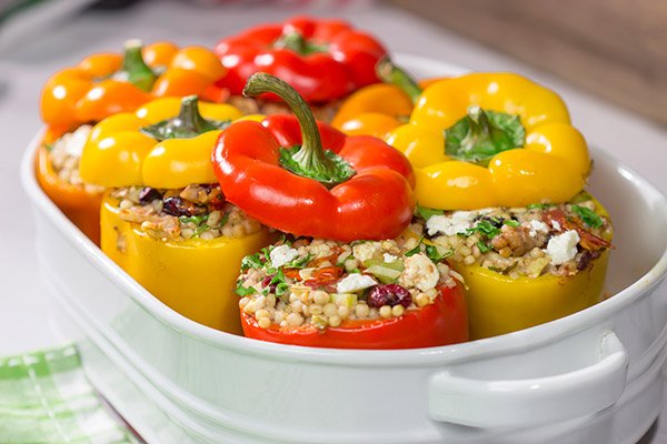 Looking for a tasty way to shake the winter blues? Put these Couscous Stuffed Peppers on the dinner menu! Packed with Mediterranean flavor, these peppers were a huge hit in our house!