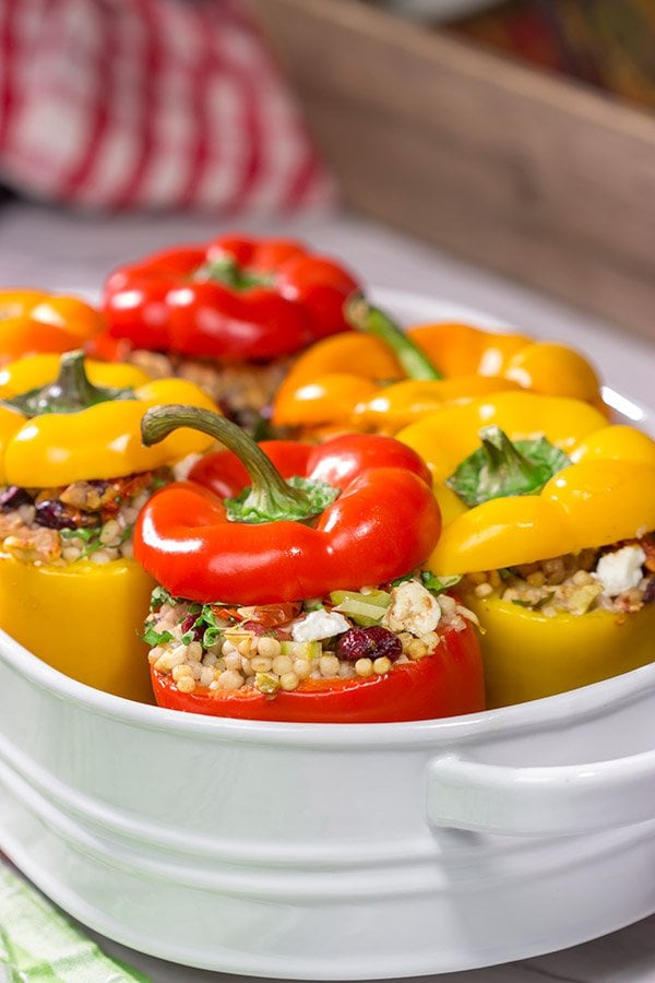 Looking for a tasty way to shake the winter blues? Put these Couscous Stuffed Peppers on the dinner menu! Packed with Mediterranean flavor, these peppers were a huge hit in our house!
