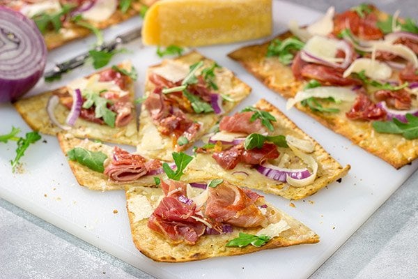 This Crispy Prosciutto Flatbread makes for a great heavy appetizer or light lunch. It tastes even better served with a glass of wine and good company!