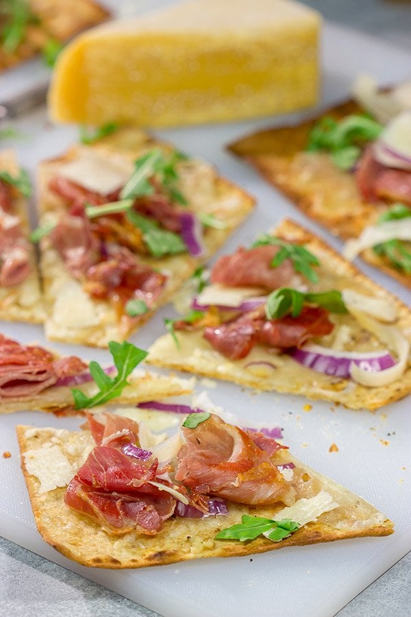 This Crispy Prosciutto Flatbread makes for a great heavy appetizer or light lunch. It tastes even better served with a glass of wine and good company!