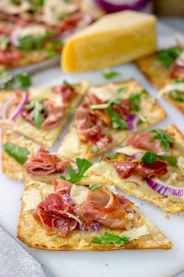 This Crispy Prosciutto Flatbread makes for a great heavy appetizer or light lunch. It tastes even better served with a glass of wine and good company!