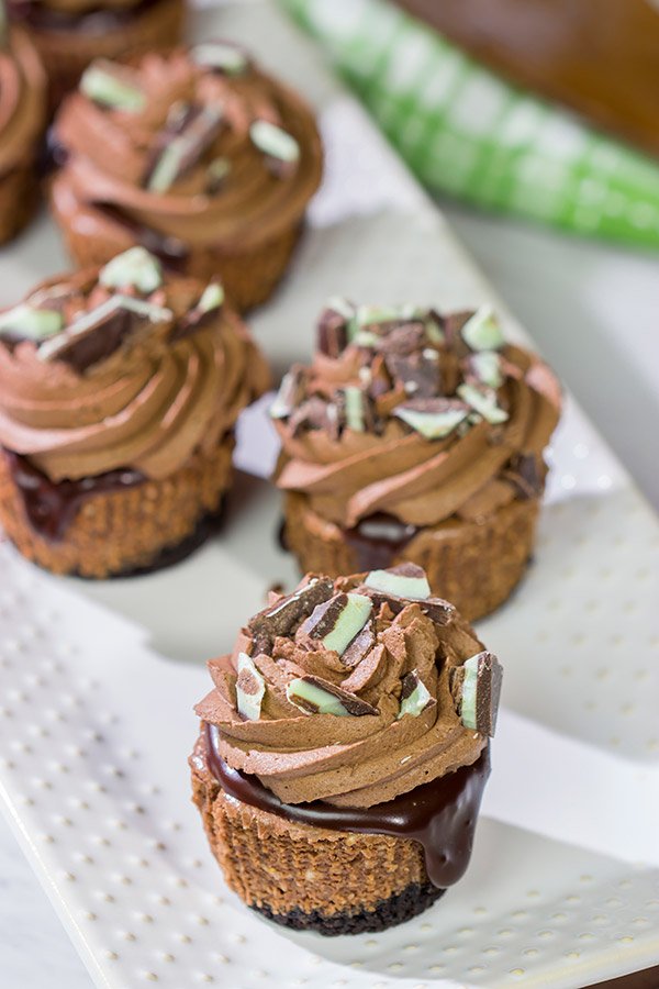 Topped with chocolate ganache and chocolate whipped cream, these Mini Chocolate Cheesecakes are perfect for the chocoholic in your life!