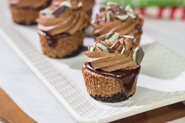 Topped with chocolate ganache and chocolate whipped cream, these Mini Chocolate Cheesecakes are perfect for the chocoholic in your life!