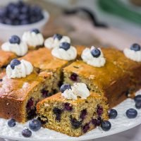 Packed with fresh blueberries and topped with a dollop of ginger whipped cream, this Blueberry Breakfast Cake is a great way to start a summer weekend morning!