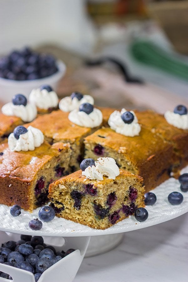Packed with fresh blueberries and topped with a dollop of ginger whipped cream, this Blueberry Breakfast Cake is a great way to start a summer weekend morning!