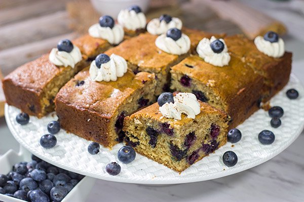 Packed with fresh blueberries and topped with a dollop of ginger whipped cream, this Blueberry Breakfast Cake is a great way to start a summer weekend morning!